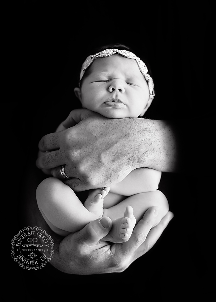 baby in dad hands newborn portrait Buffalo NY