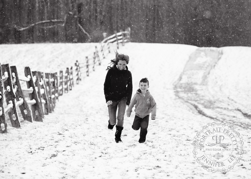 mommy and son running snow portrait