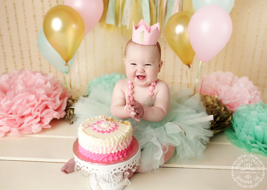 pink mint and gold first birthday cake smash portraits by portrait pretty photography